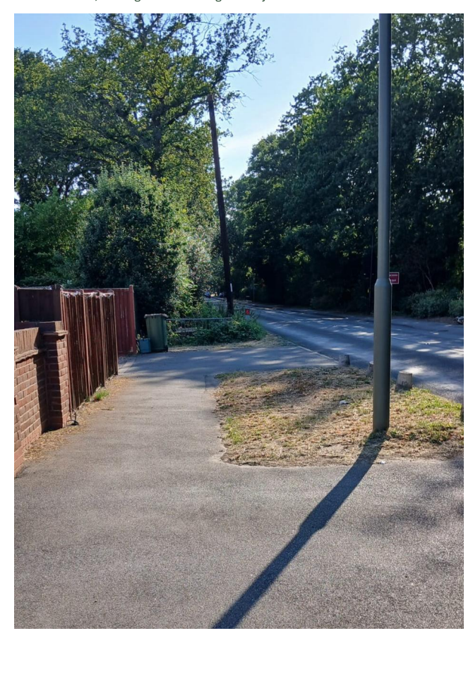 Burwood Road looking west, showing the footway at Vaux Crescent
